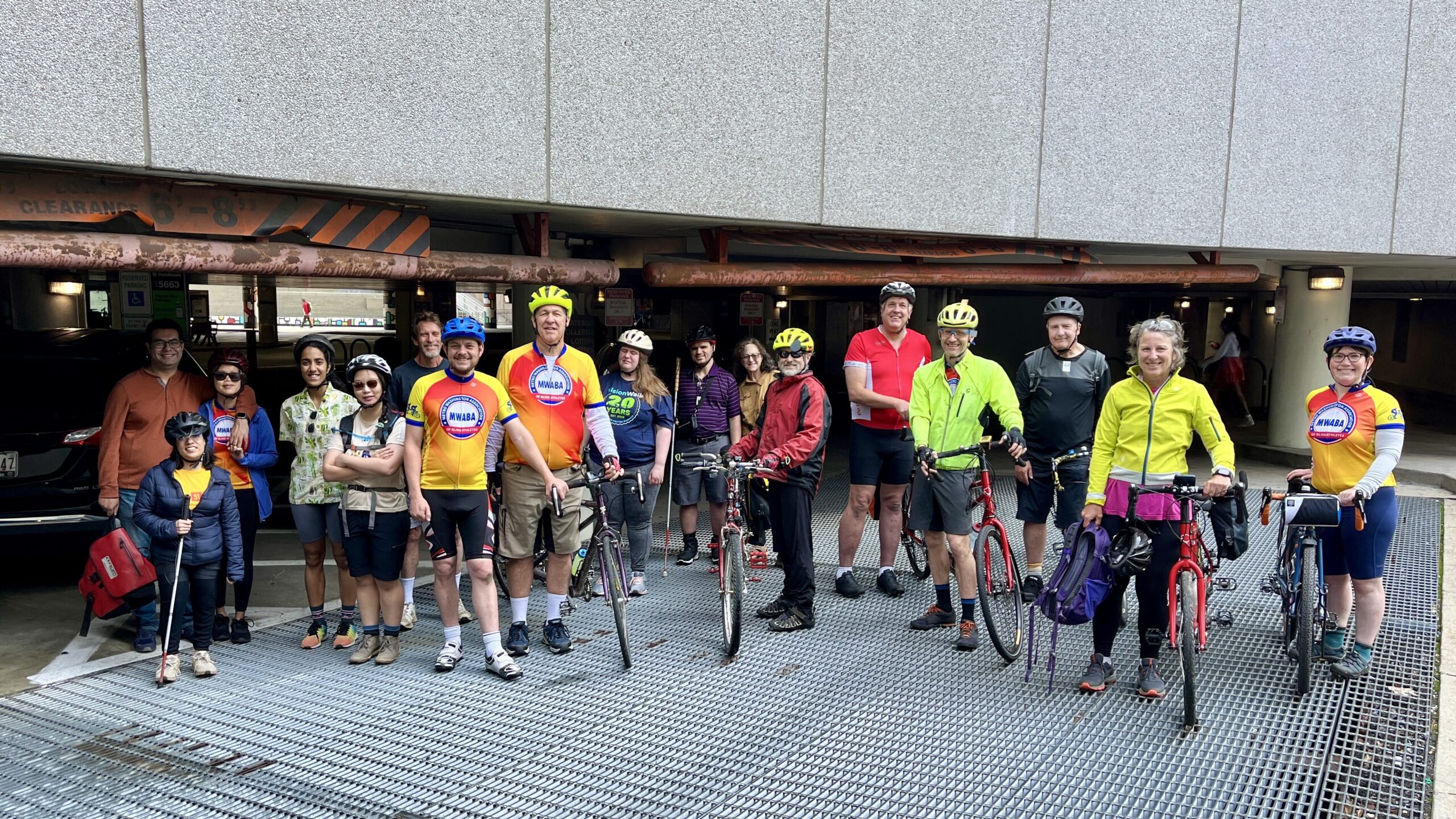 Seventeen participants pose with tandem bikes at the Bethesda locker before the group sets off for Lake Fairfax on our bike camping trip in May.
